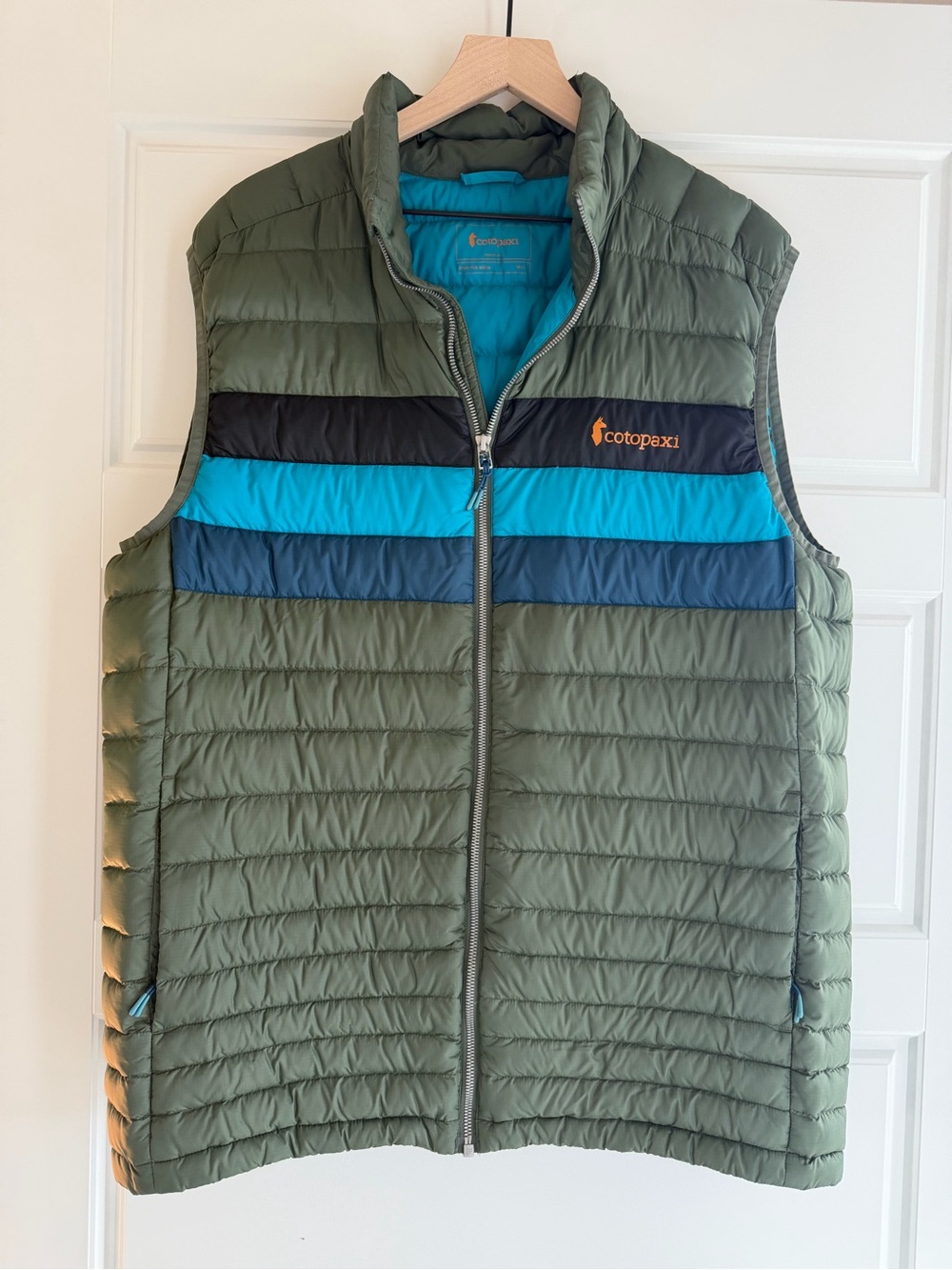 cotopaxi Olive Quilted Puffer Vest with Black and Blue Chest Stripes